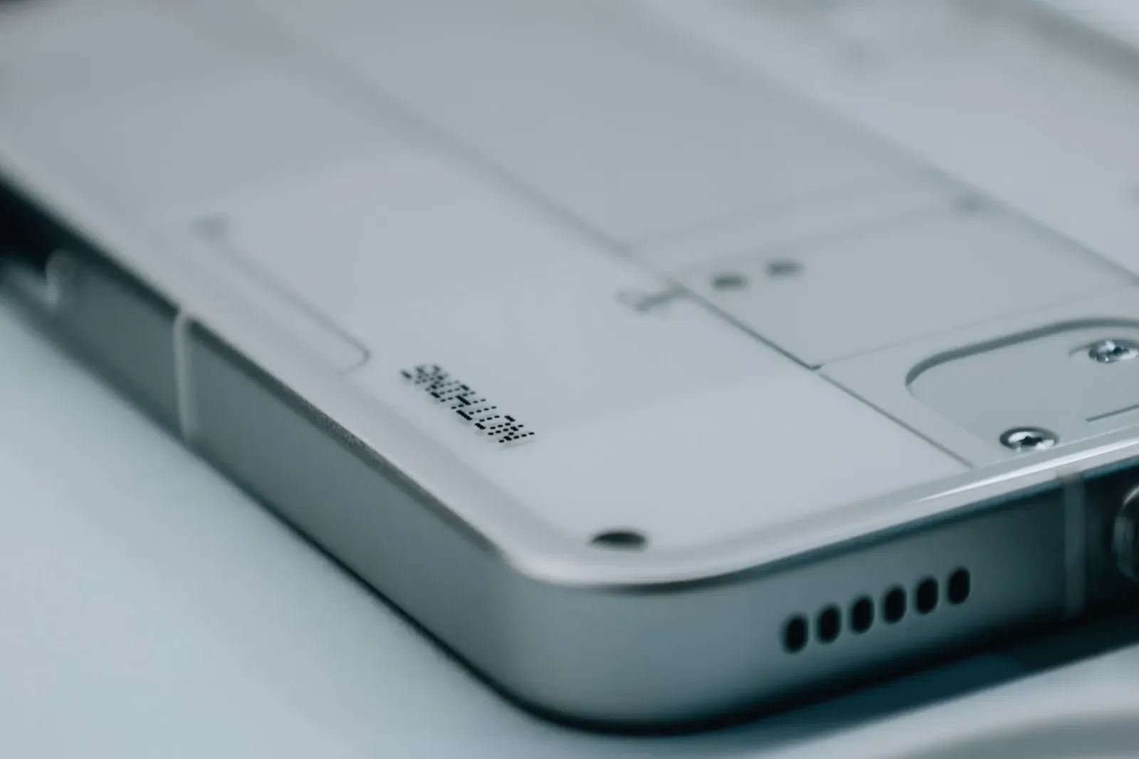Detailed view of a sleek smartphone's edge and camera module, highlighting design.